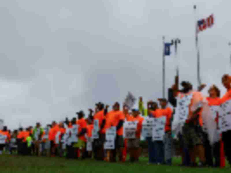 Biden says sees progress in US port labor dispute as strike enters third day