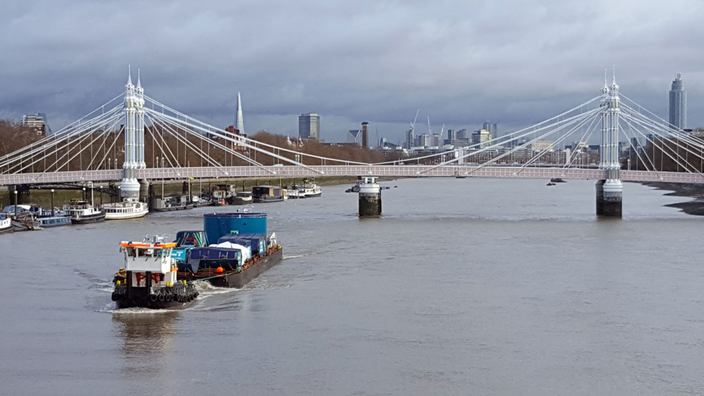 The first tunnel boring machine (TBM) is transported by Mammoet along the River Thames.