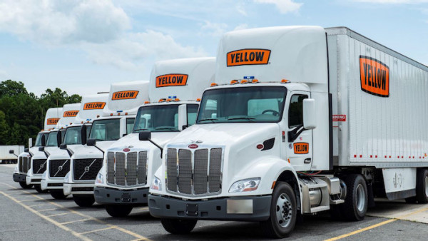 https://www.ajot.com/images/uploads/article/Yellow-Trucks-Lined-Up-2.jpg